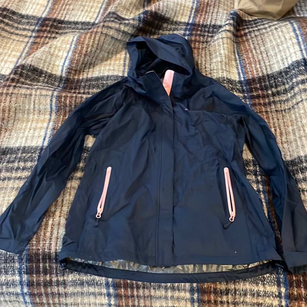 Navy blue rain or wind type jacket.